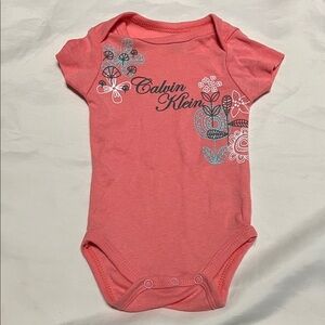 “Bundle 10/$13” Calvin Klein 0-3M Coral Baby girl bodysuit with Floral Accents